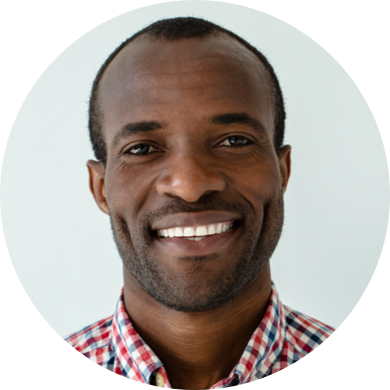 Mike, smiling man with short hair in a checkered shirt, worker profile avatar